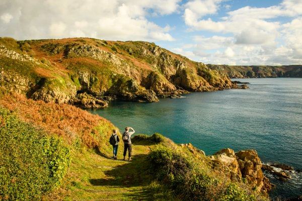 Walkers on the Guernsey coast